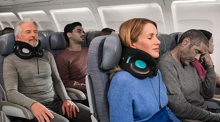 Passengers comfortably on an airplane with Evolution X neck pillows