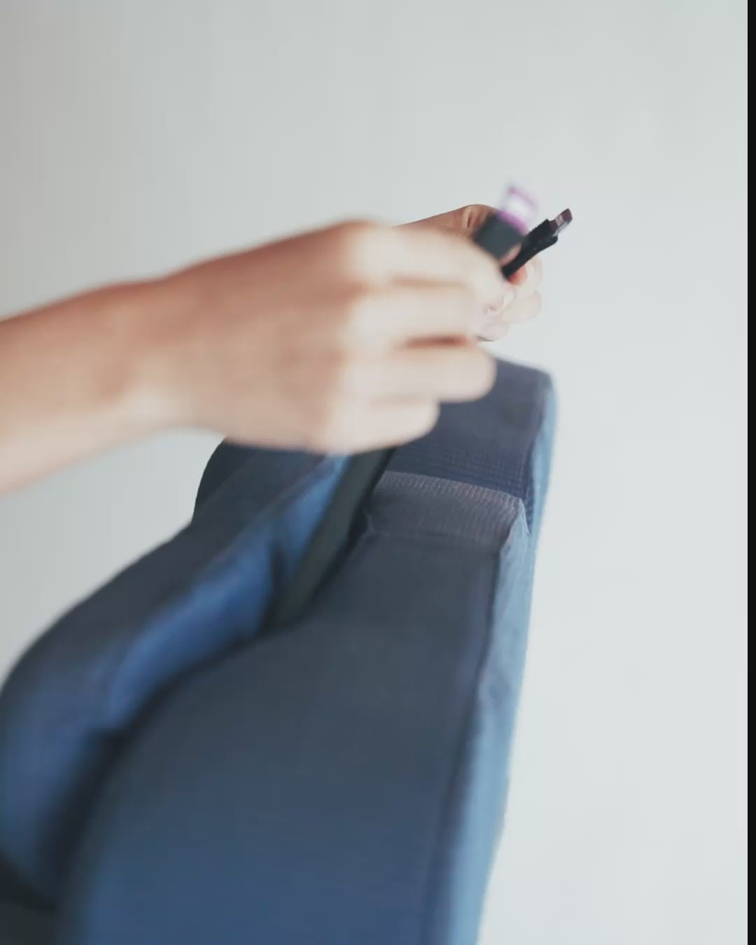 Securing seat straps to plane seat headrest to keep pillow in place